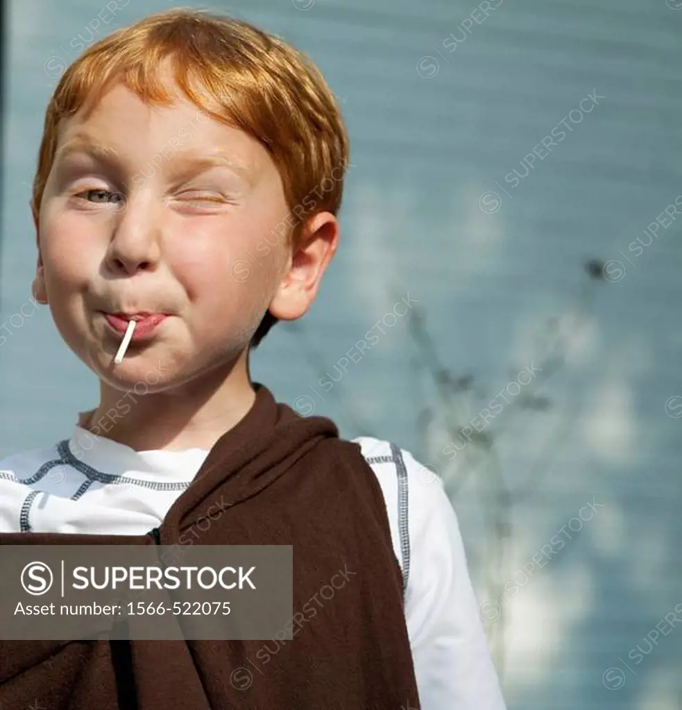Boy eating a lollipop