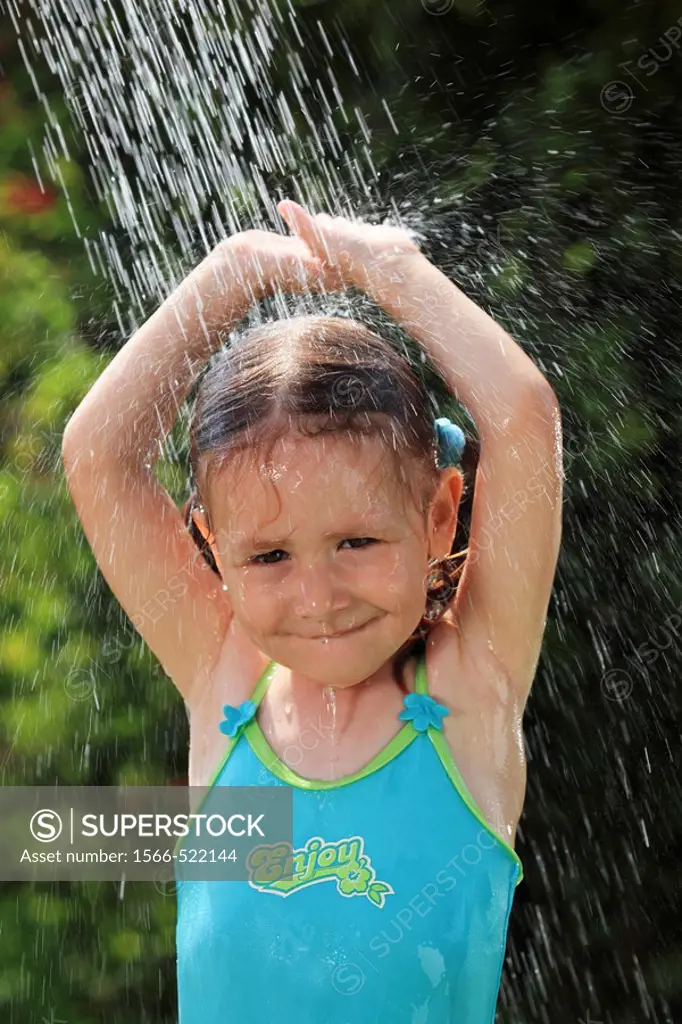 girl having shower outdoors, Switzerland