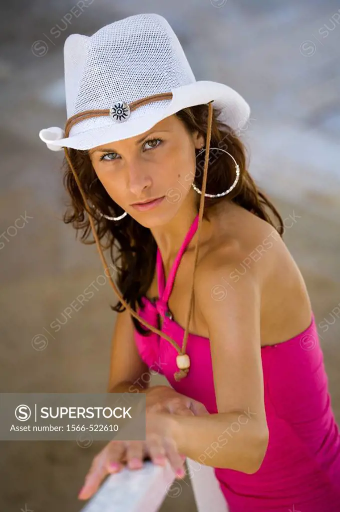 Young woman with White hat and big earrings