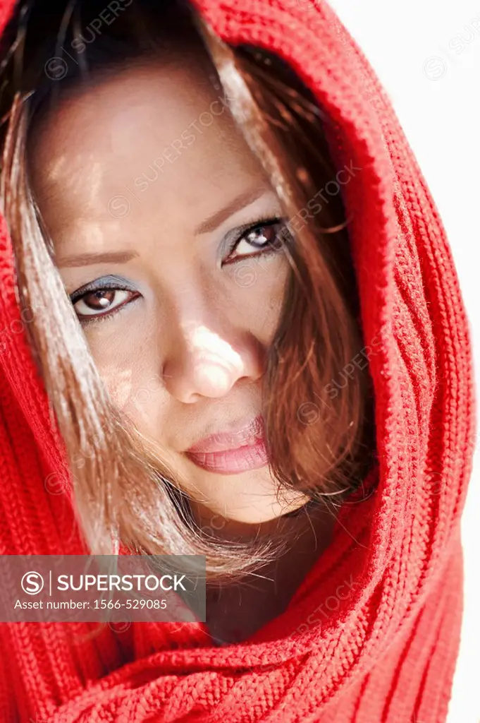 Portrait of an Asian woman in red scarf
