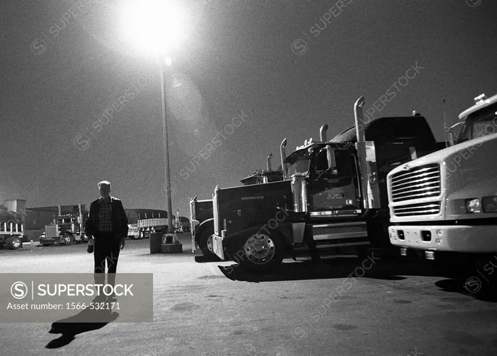 Dearborn, Michigan - Teamster truck driver at a truck stop in a busy, industrial area near Detroit  MR