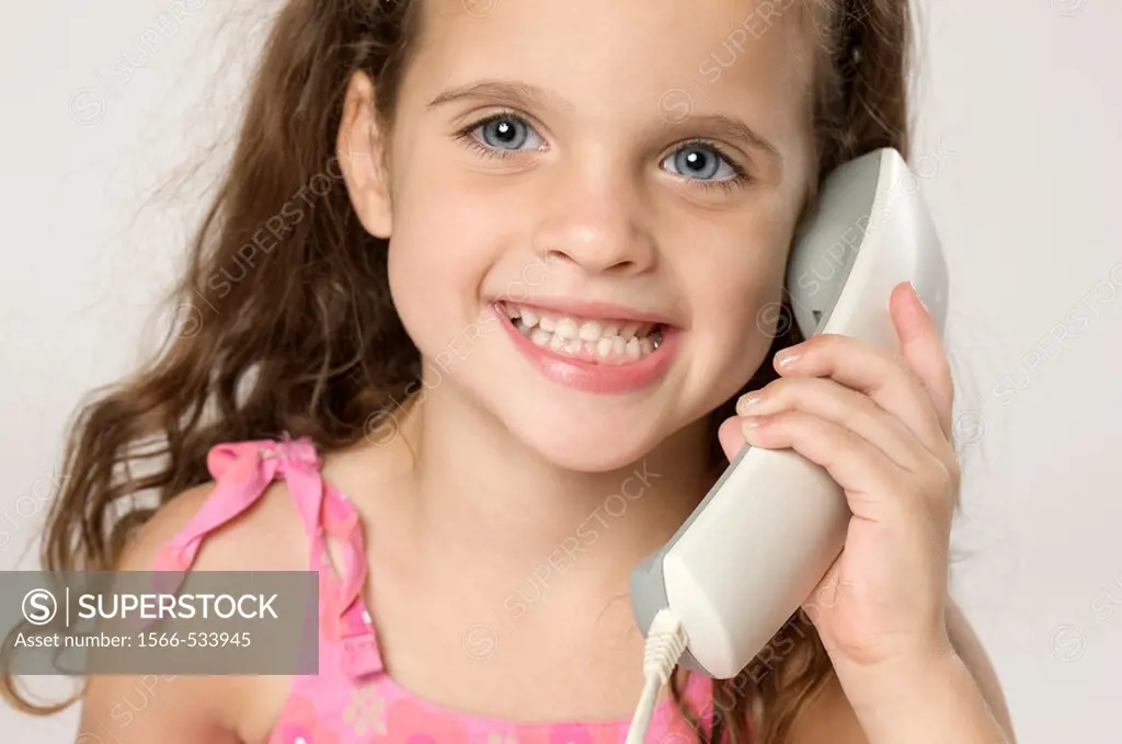 Four year old twins talking on the phone