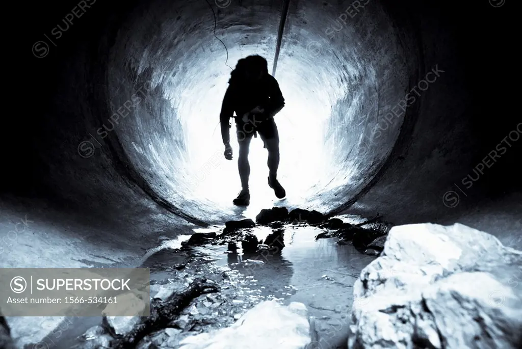 Man emerging from a tunnel, Serres, Hautes-Alpes, Southern France
