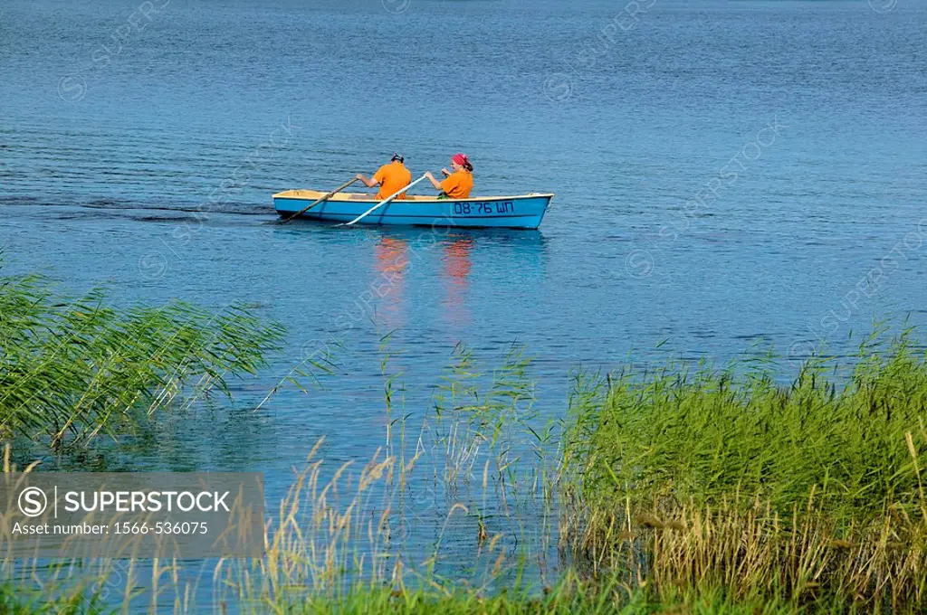 Couple paddling in a canoe on Lake Onega, Russia