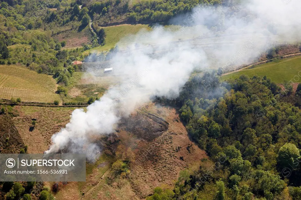 Stubble burning near Getaria, Guipuzcoa, Basque Country, Spain