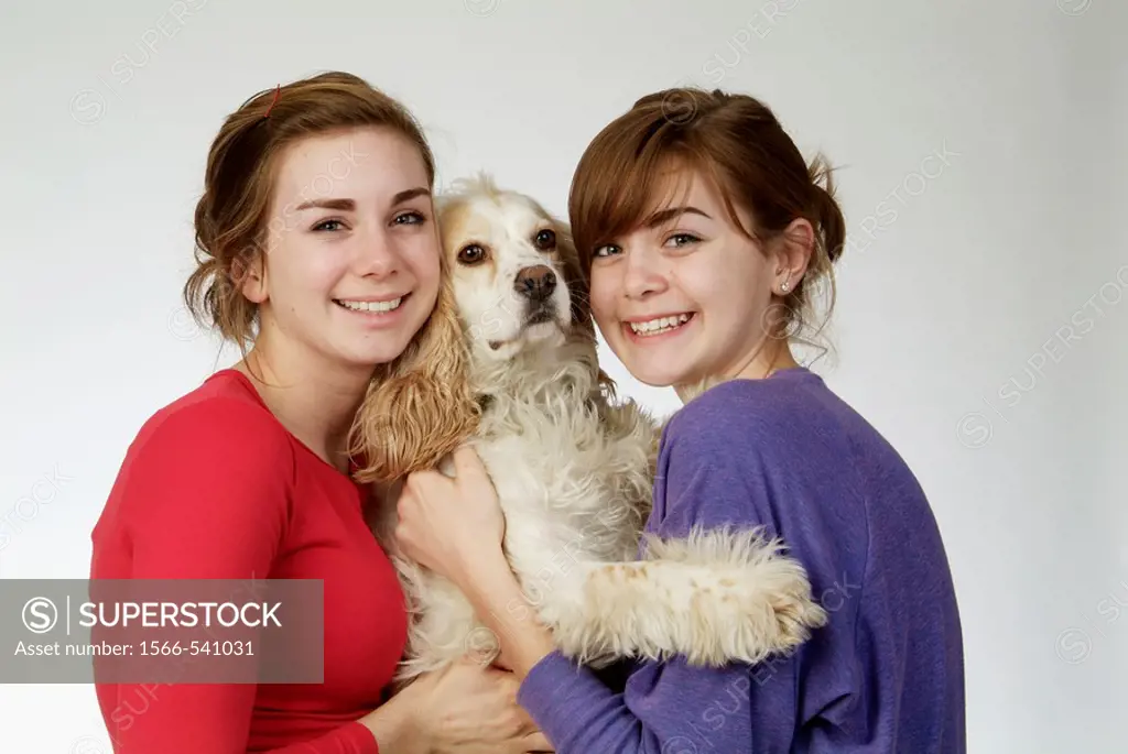 Two girls, 14 and 18, in studio with dog