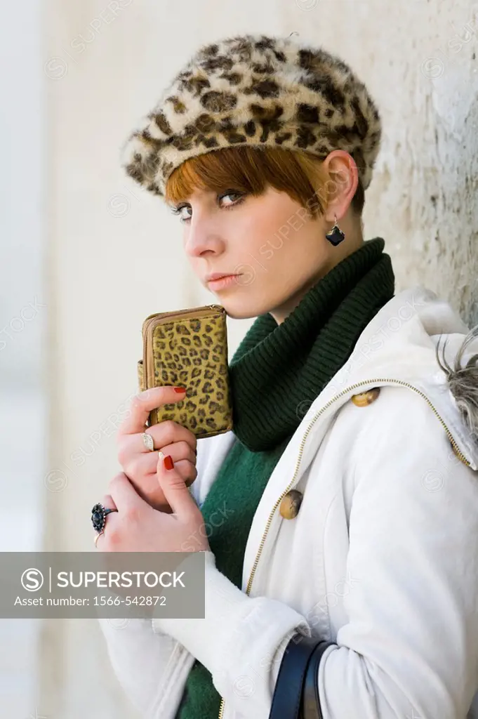 Young woman with a wallet in her hands