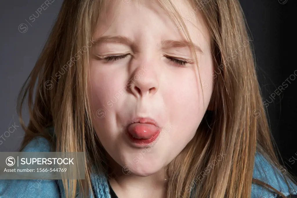 Girl sticking out tongue