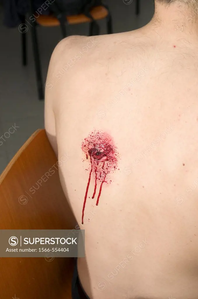 Mock up injury of a gun shot wound  The exit wound in the victim´s back Injury created with make up  Model Release available