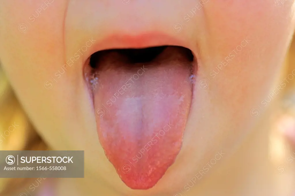 Child puts out tongue, two years old