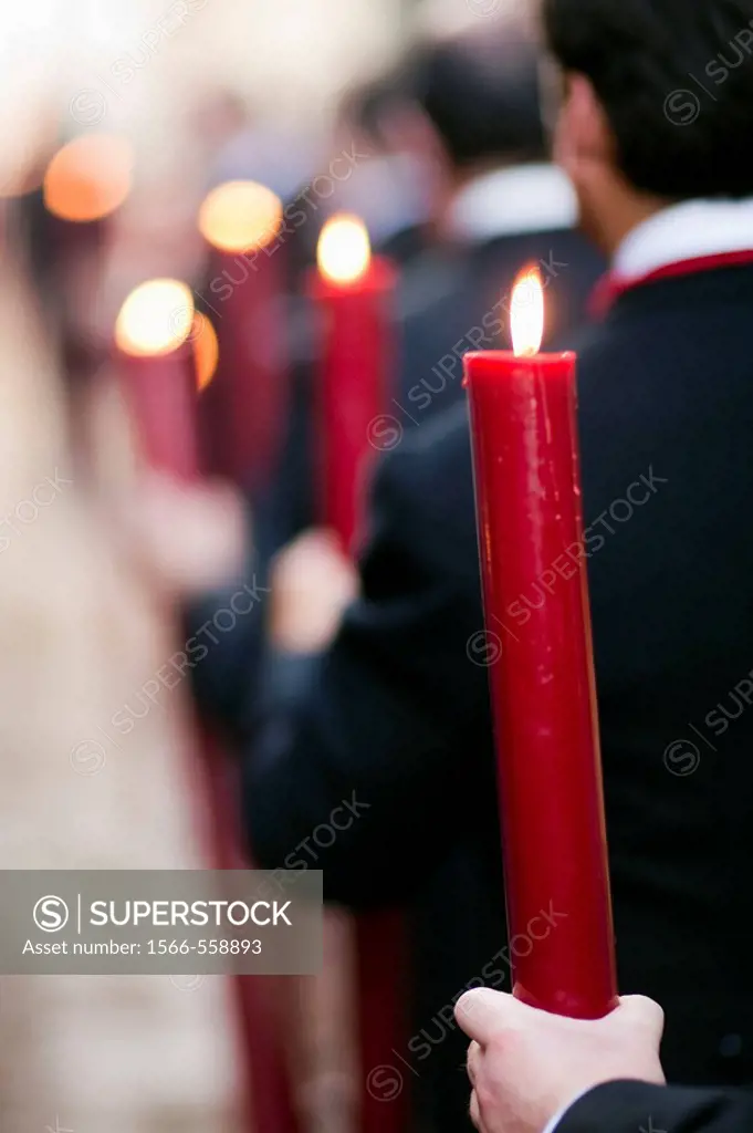Brotherhood members bearing candles, Corpus Christi procession, Seville, Spain, 2009.