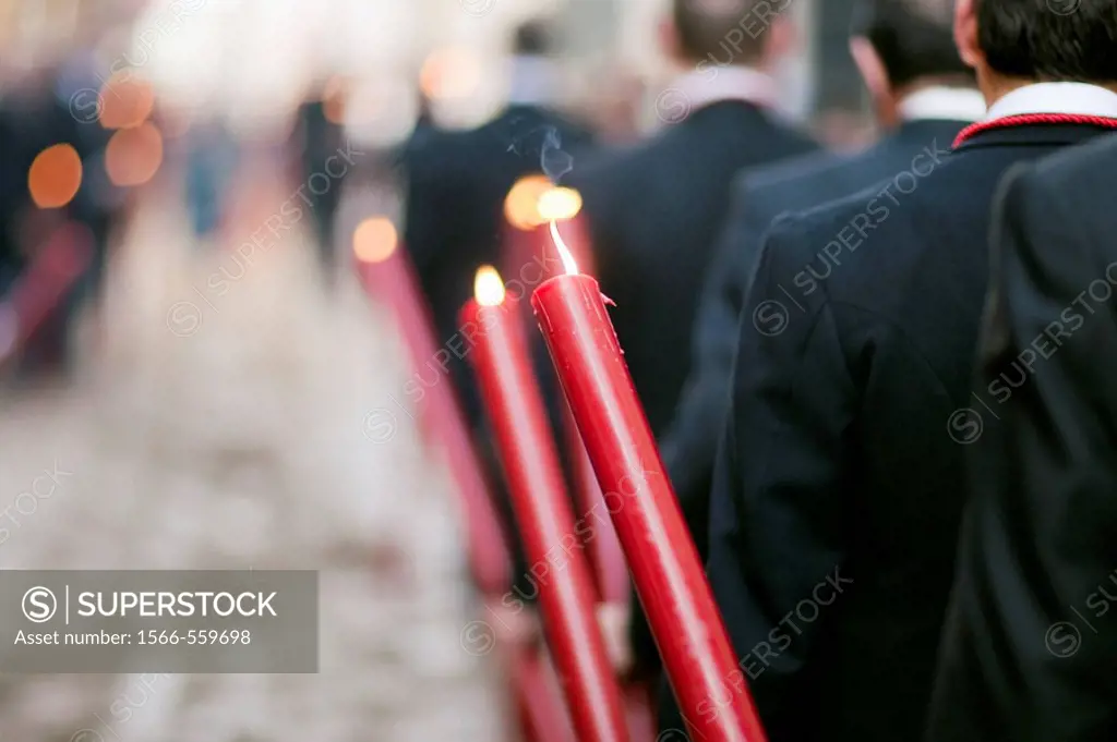 Brotherhood members bearing candles, Corpus Christi procession, Seville, Spain, 2009.