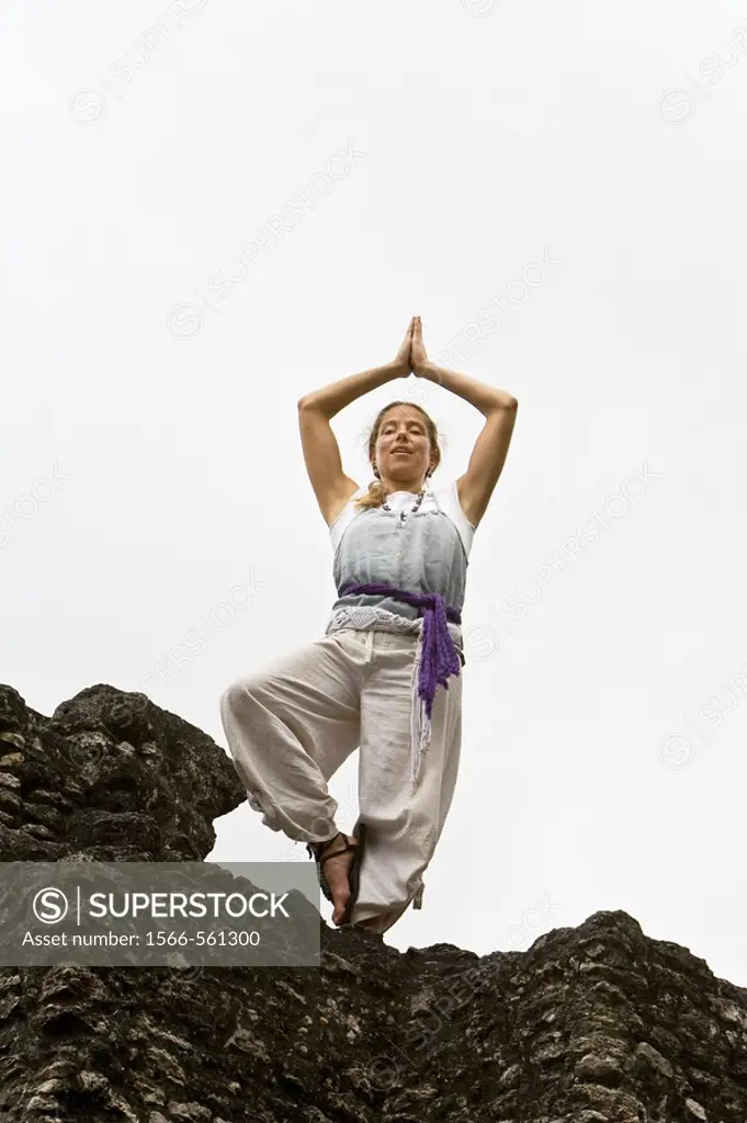 Guatemala, Tikal, woman doing Yoga
