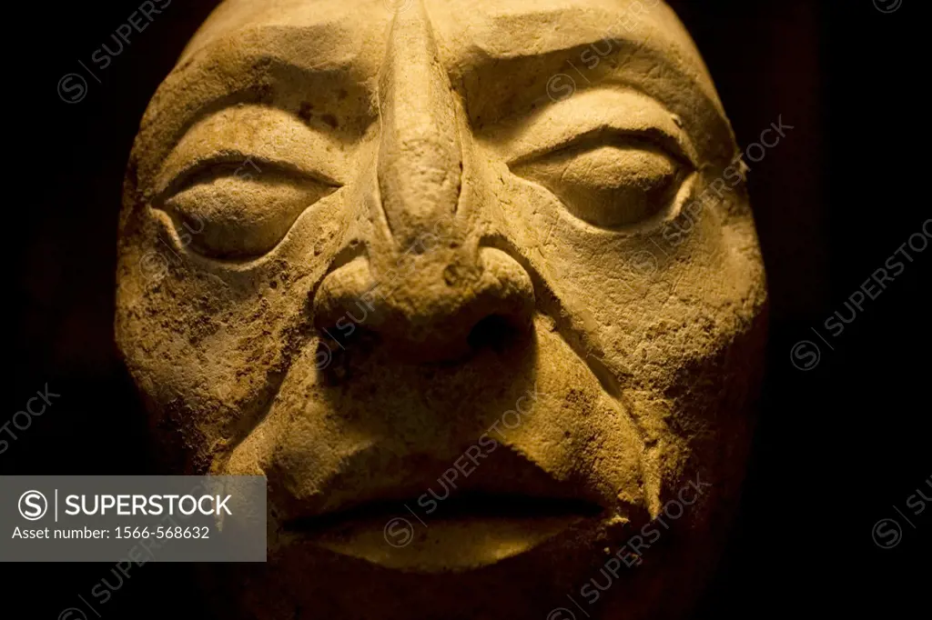 A human head sculpture sits on display in the museum at the ancient Mayan city of Palenque, Chiapas, Mexico.