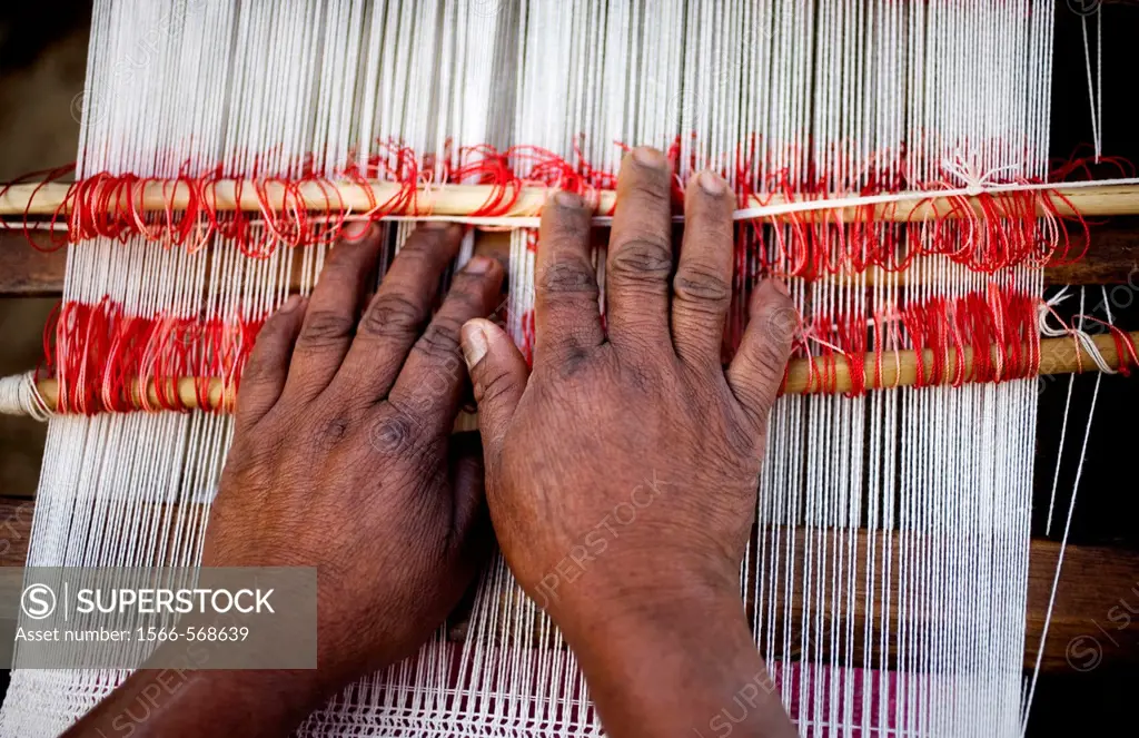 A woman weaves a shawl outside her home in San Andrés Tzicuilan, on the outskirts of Cuetzalan del Progreso, Mexico. Cuetzalan is a small picturesque ...