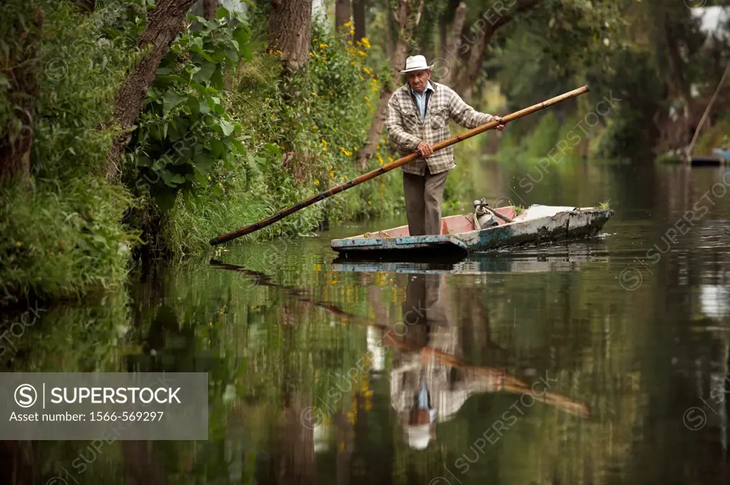 A farmer navigates through the water canals of San Gregorio Atlapulco village in Xochimilco, southern Mexico City