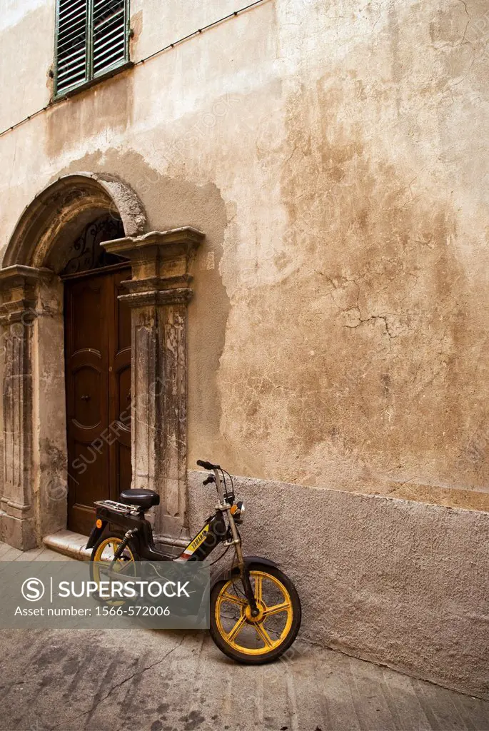 Moped parked outside building, Sospel, France