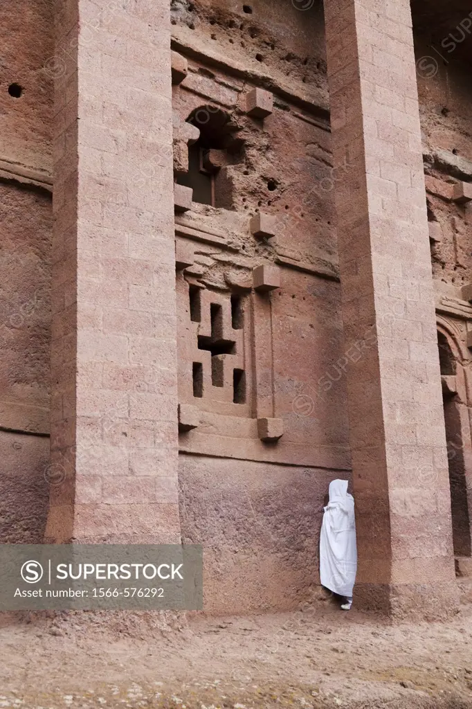 The rock-hewn churches of Lalibela in Ethiopia  Pilgrim praying in front of a church  The churches of Lalibela have been constructed in the 12th or 13...