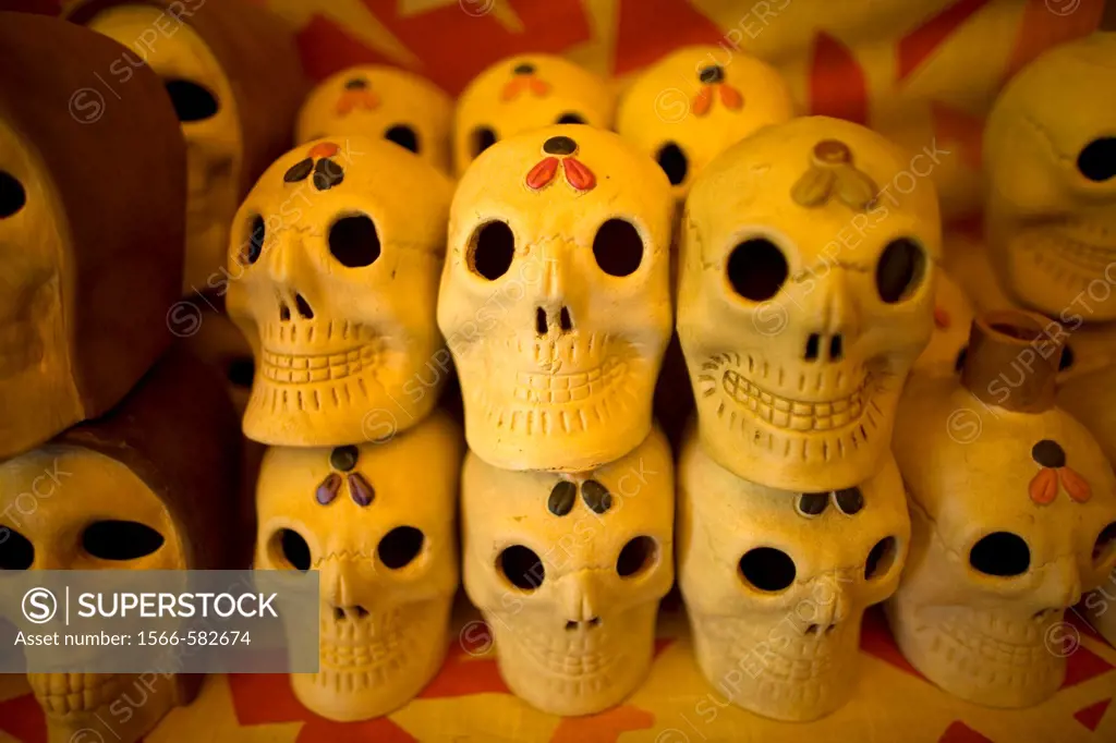 Ceramic skulls sit for sale ahead of Day of the Dead celebrations in a shop at the Jamaica Flower Market in Mexico City.