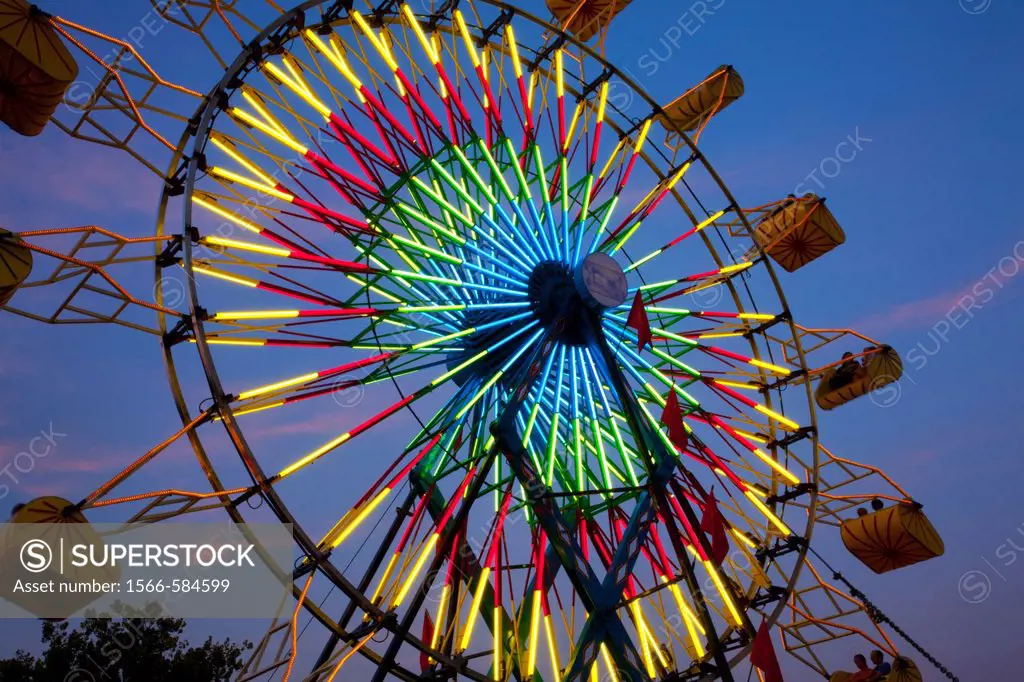 Amusement Rides with Movement Blur in the evening at the Kentucky State Fair Midway Louisville Kentucky