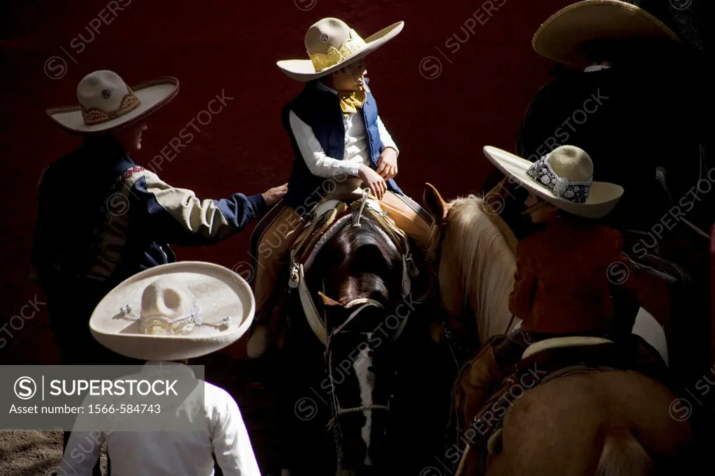 Mexican charros visit at the National Charro Championship in Pachuca, Hidalgo State, Mexico. Escaramuzas are similar to US rodeos, where female compet...