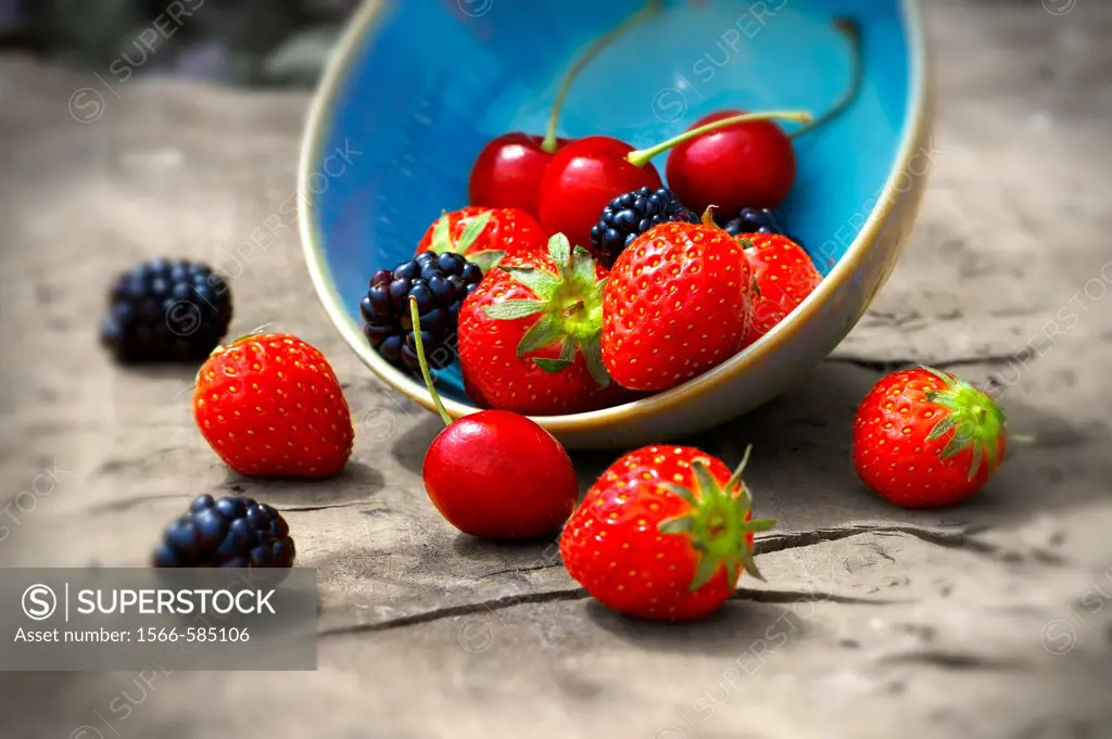 mixed fresh summer fruits - strawberry, blackberry, cherry