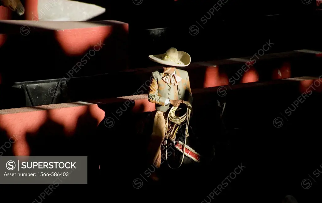 A Mexican charro holds his lasso at the National Charro Championship in Pachuca, Hidalgo State, Mexico. Escaramuzas are similar to US rodeos, where fe...