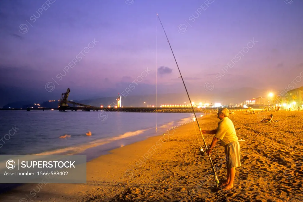 Fisherman in `Ciudad Luminosa´beach  Almeria  Andalucia, Spain