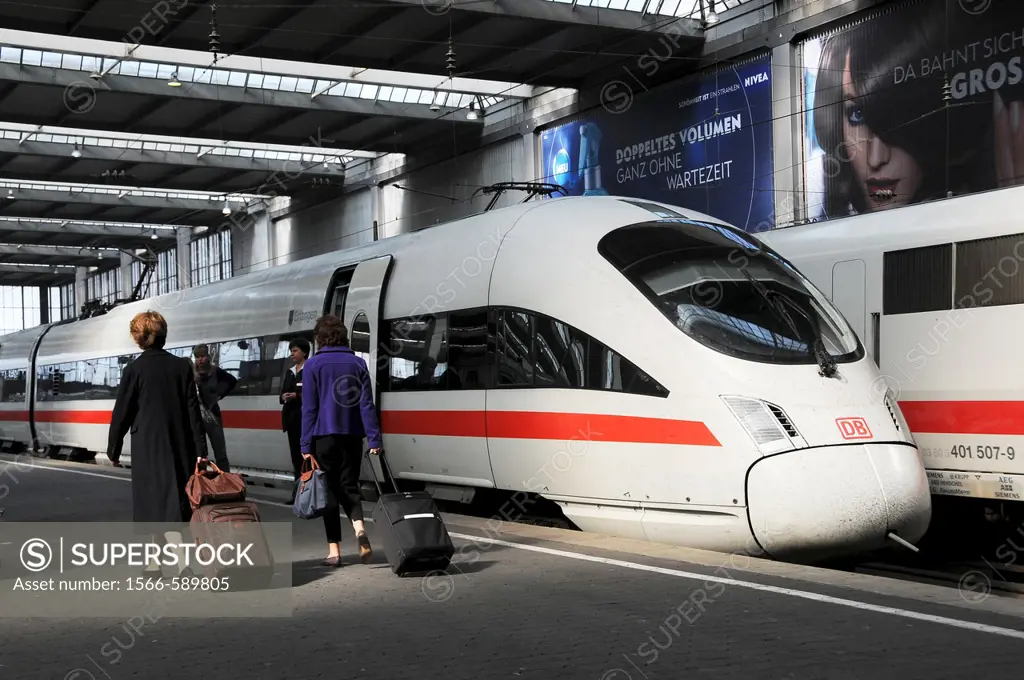 People walk at the Plattform to a ICE Train in Munich Station