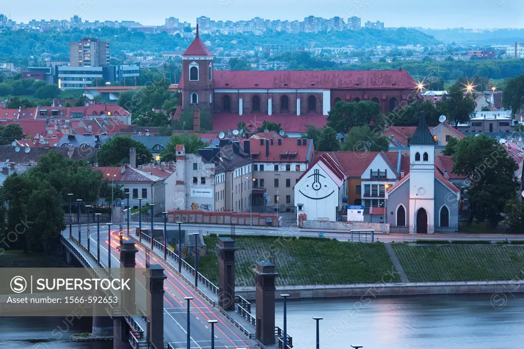 Lithuania, Central Lithuania, Kaunas, elevated view of Sts  Peter and Paul Cathedral and Aleksoto tiltas bridge, dusk