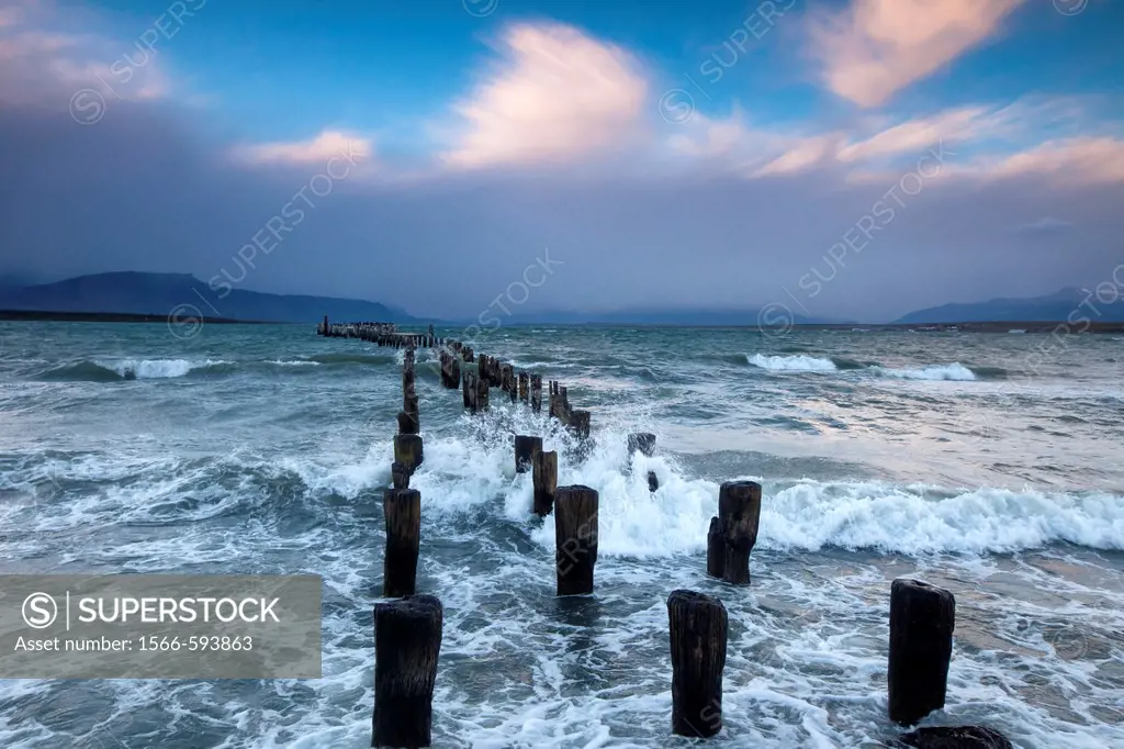 ´Braun & Blanchard´ famous old pier, storm approaching at sunset, Puerto Natales, Patagonia, Chile.
