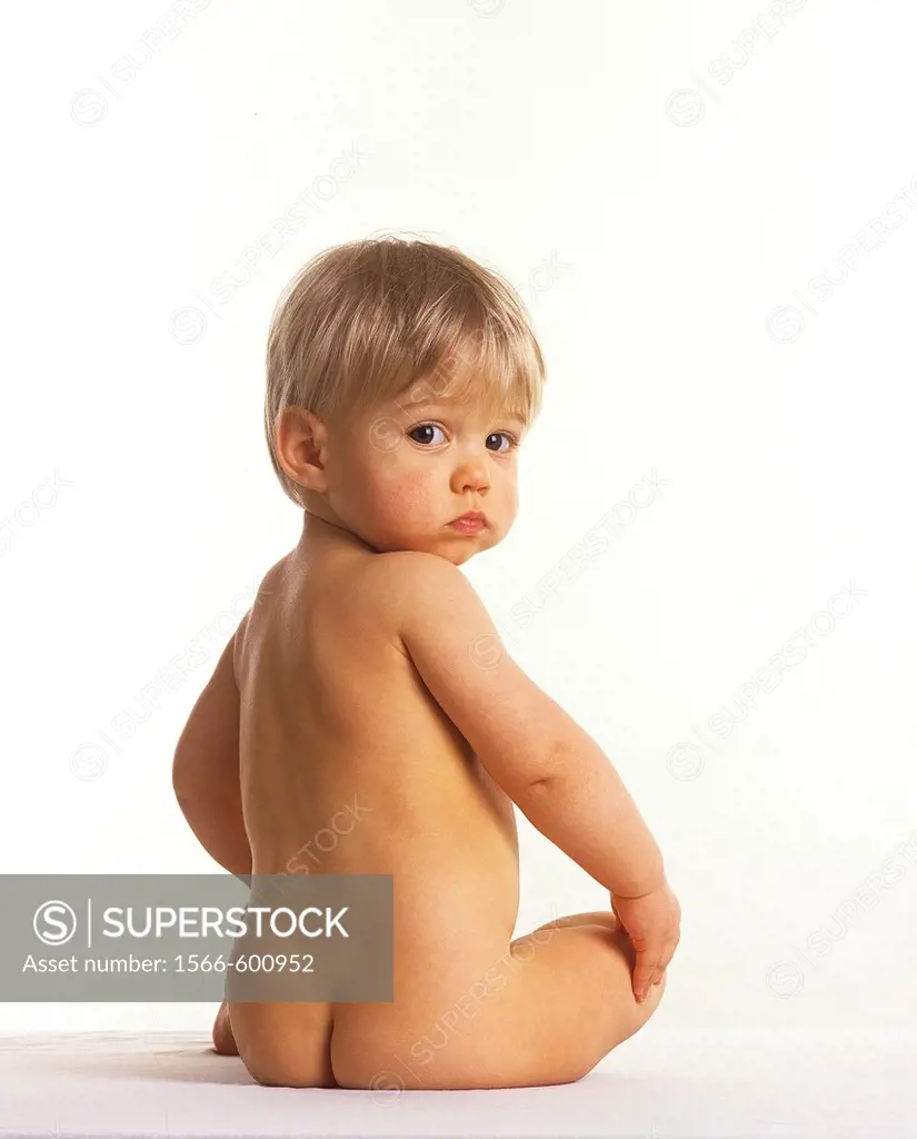 NUDE BABY GIRL AGAINST WHITE BACKGROUND