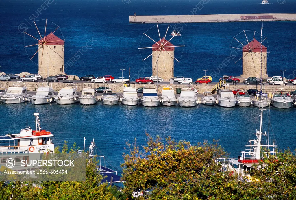Windmills in Mandraki harbour Rhodes city, Rhodes Island, Greece.