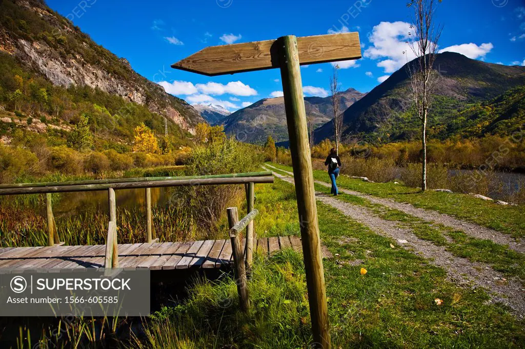 Woman  Hiking  Information sign  Camí de l´Aigua  Barruera. Boi-Taull Valley, Alta Ribagorça Region, Peripheric area, Aigüestortes i Estany de Sant Ma...