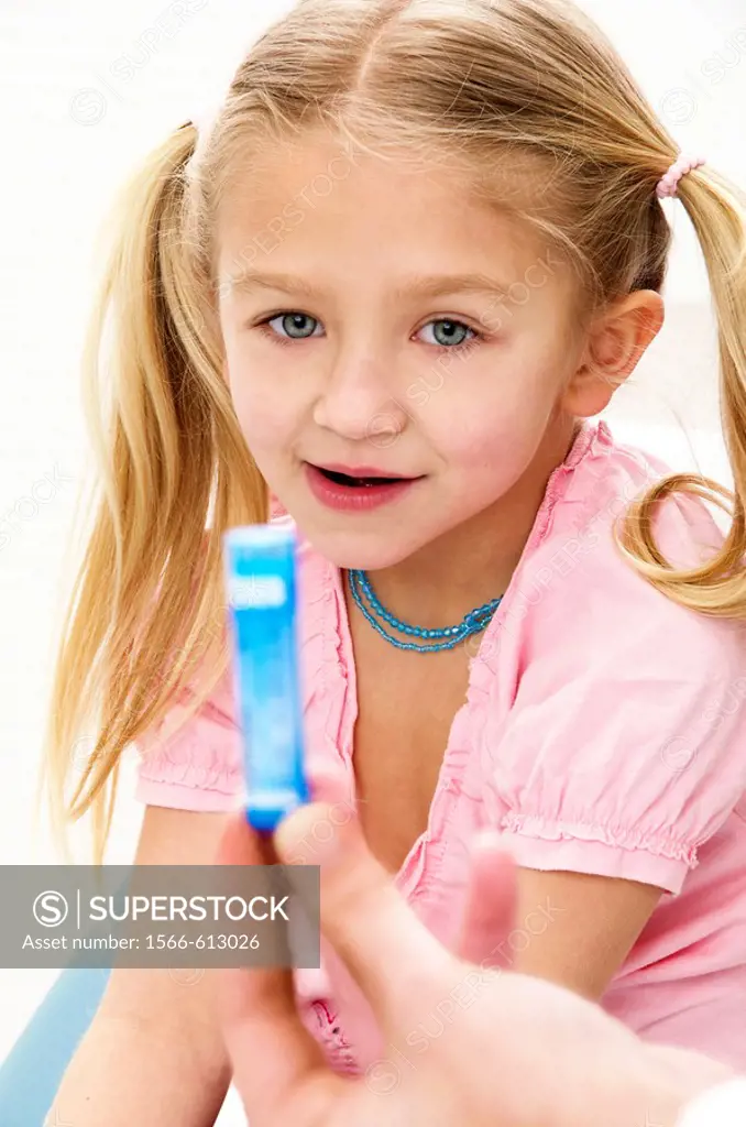 girl 7 with homeopathy blue tube