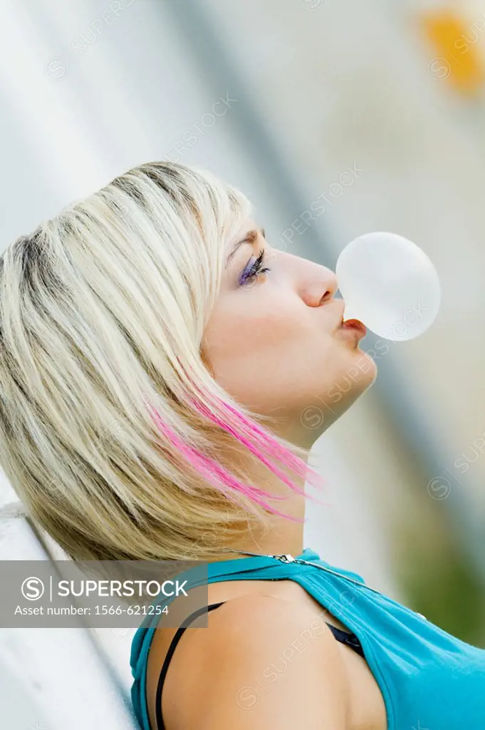 Blowing a bubble gum