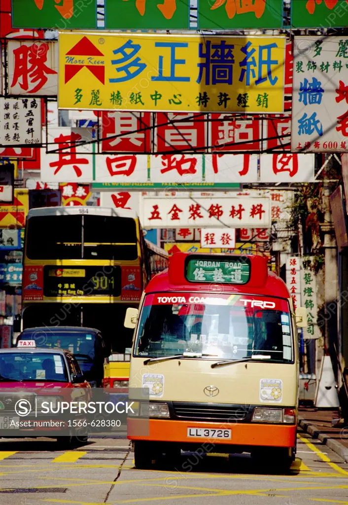 Bus and taxi waiting at an intersection in Kowloon Hong Kong