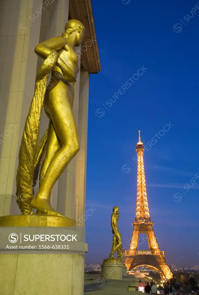 Sculpture on the terrace of Palais de Chaillot with Eiffel Tower in the background, Paris, France.