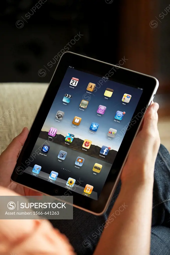 Close up of a woman handholding an iPad