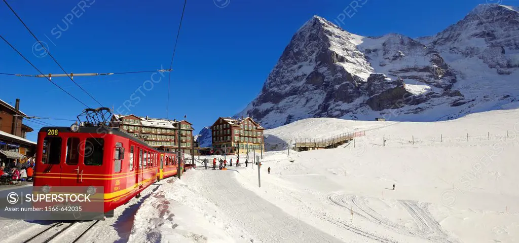 Jungfraujoch train at Kleiner Scheidegg in winter with The Eiger left then The Monch Mountains  Swiss Alps Switzerland