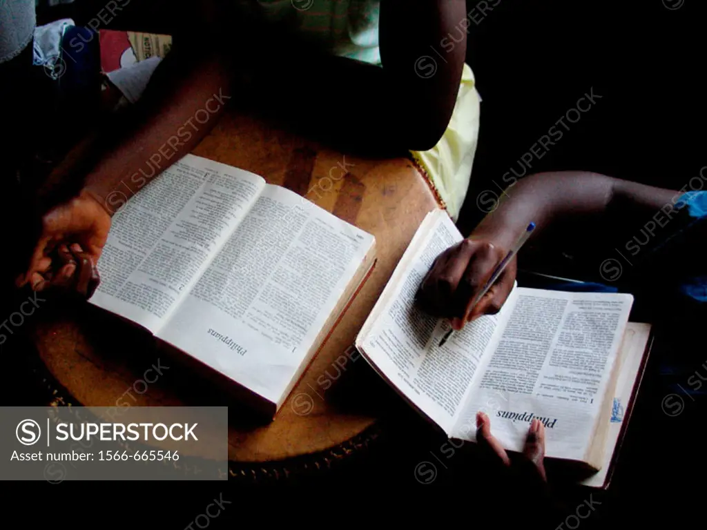 Children at the Kampala School for the Physically Handicapped, Uganda read bibles during Sunday school.