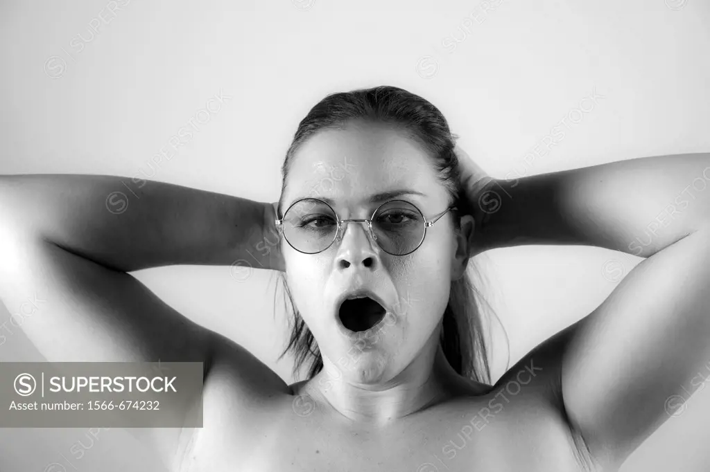 Young woman yawning