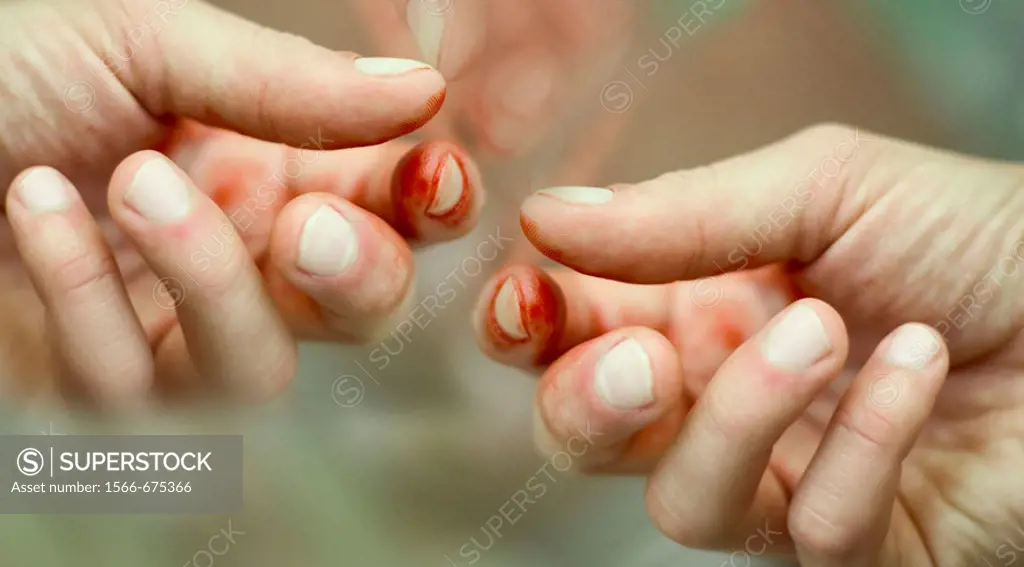Hands stained  with blood.
