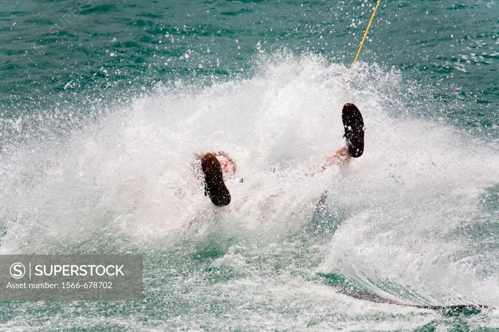 Almost submerged wakeboarder in a splash of water