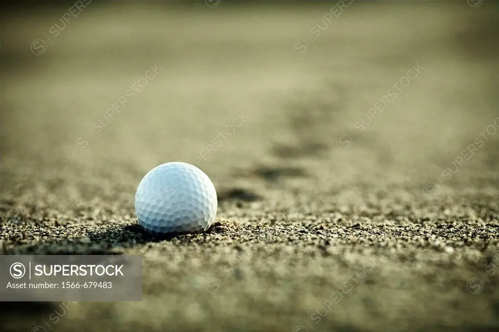 Golf ball in the sand  Foreground