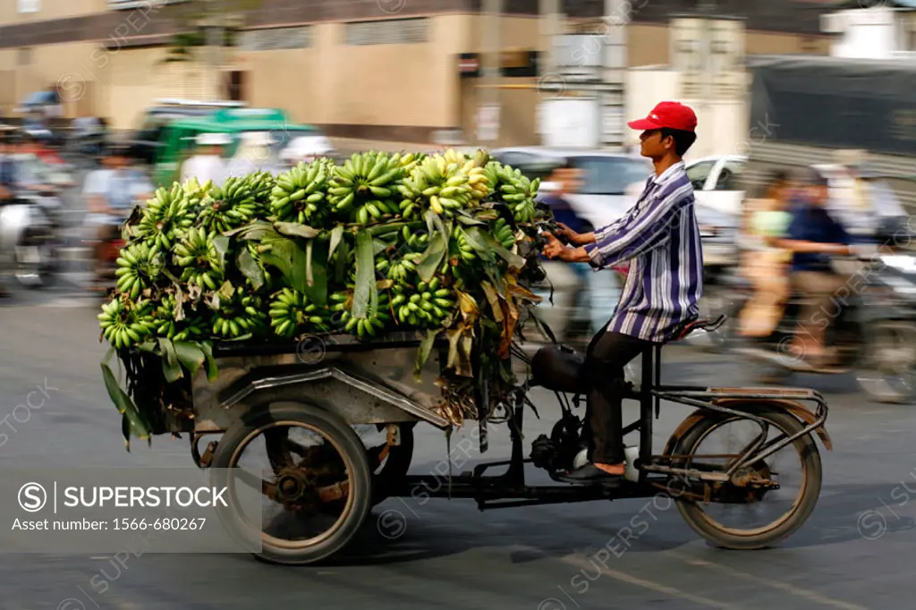 Speeding vietnamese moto rickshaws with Bananas. Saigon, Vietnam.