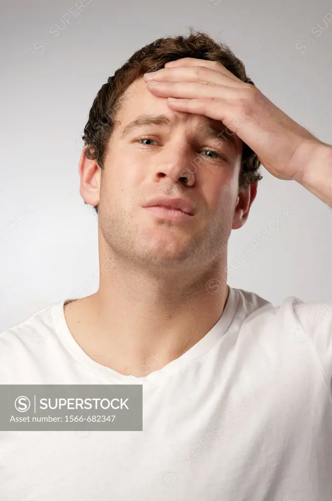 White caucasian male man suffering with a headache sore head hangover.