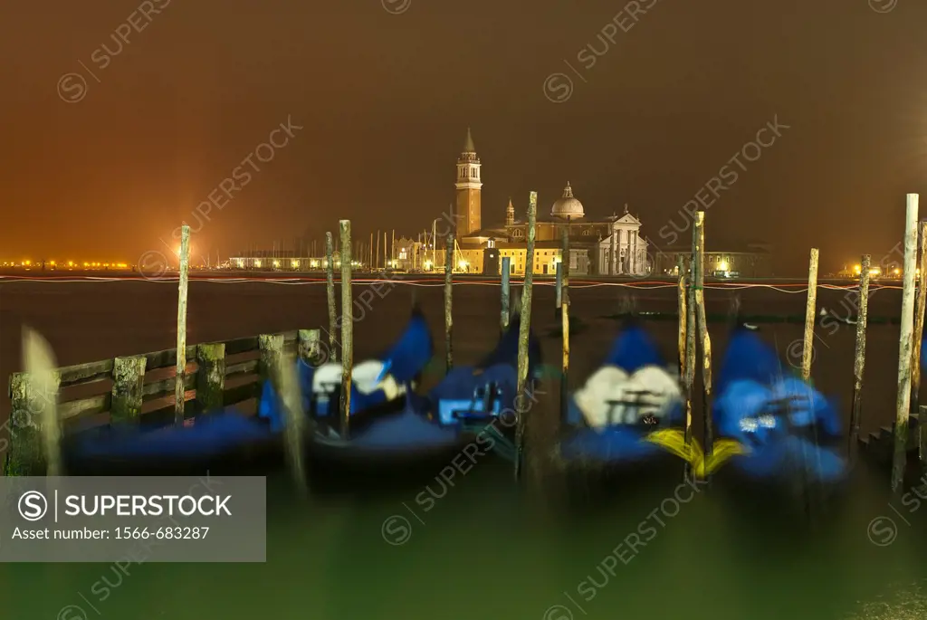 Gondolas at night, Venice, Italy.