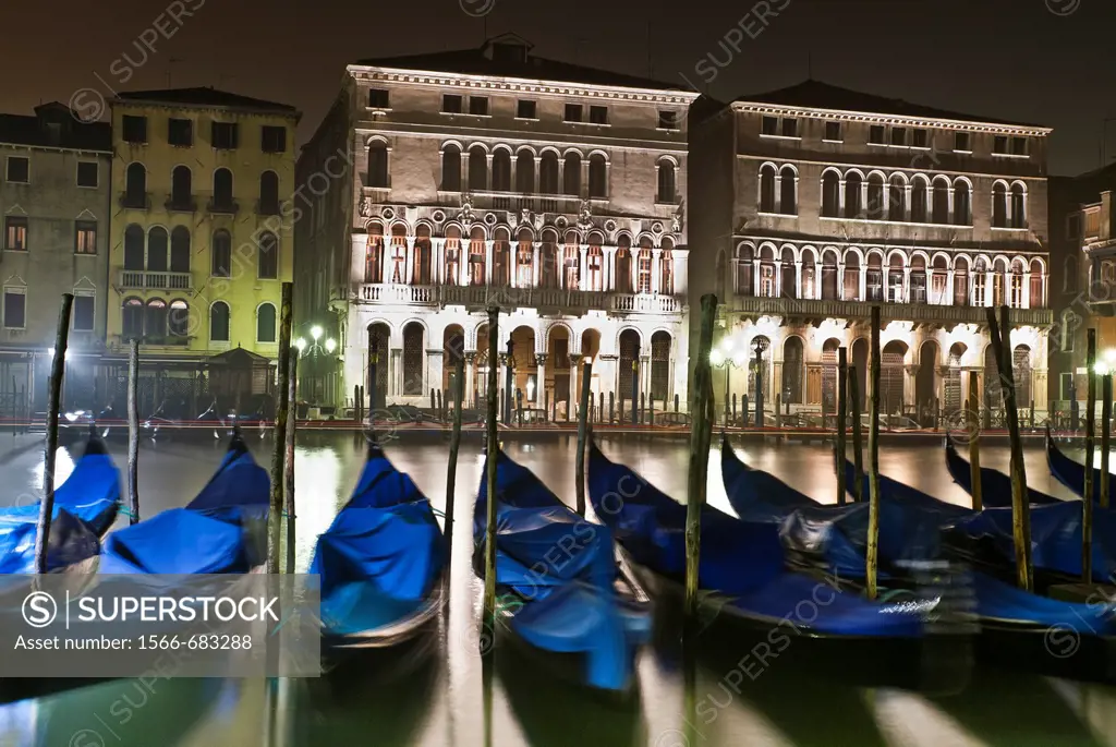 View of the Grand Canal and gondolas at night, Venice, Italy.
