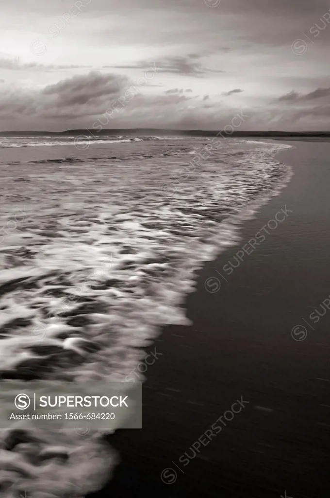 Incoming wave on the beach at Westward Ho! on the North Devon coast, England, United Kingdom